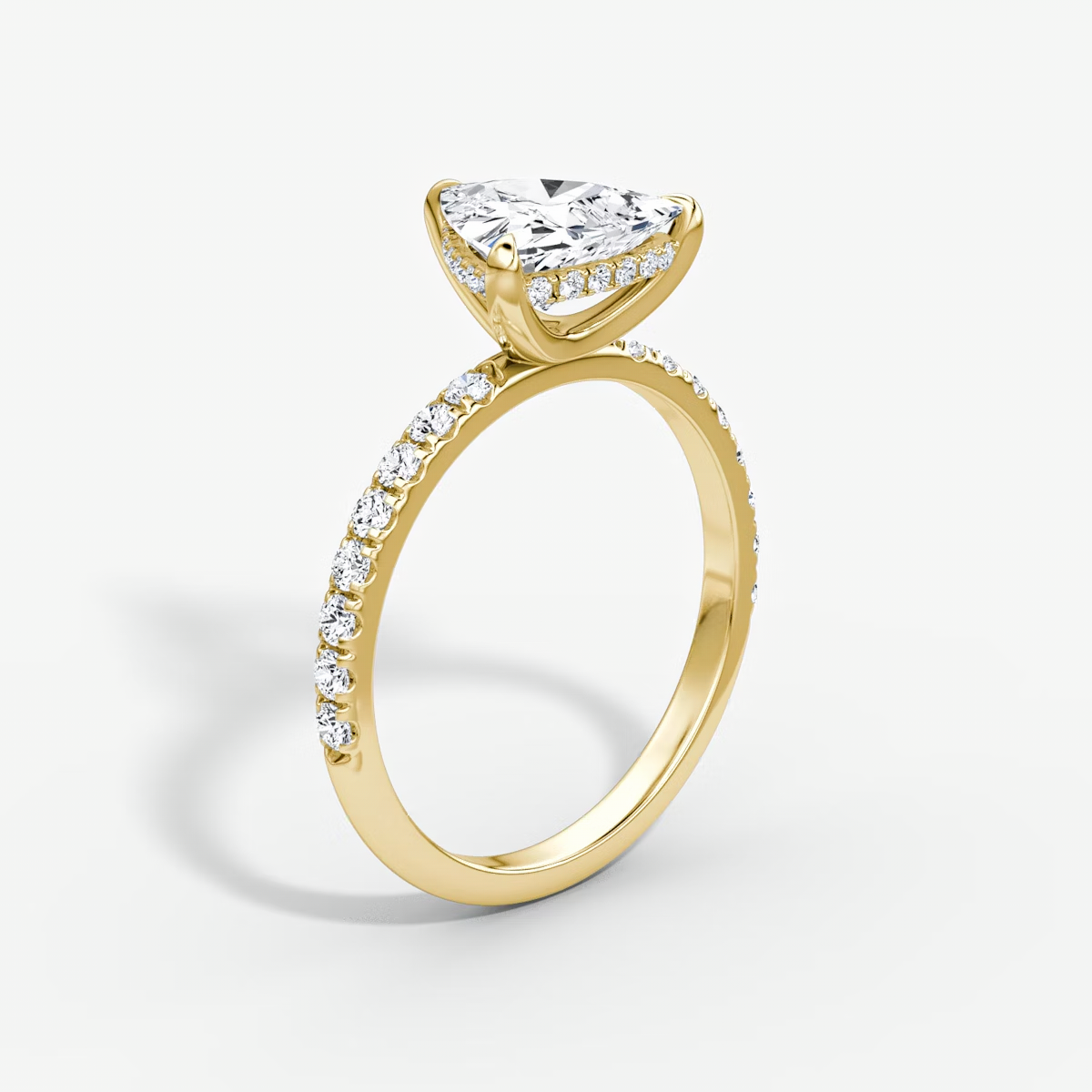 The Classic Hidden Halo Trillion Engagement Ring in Pave Large Band